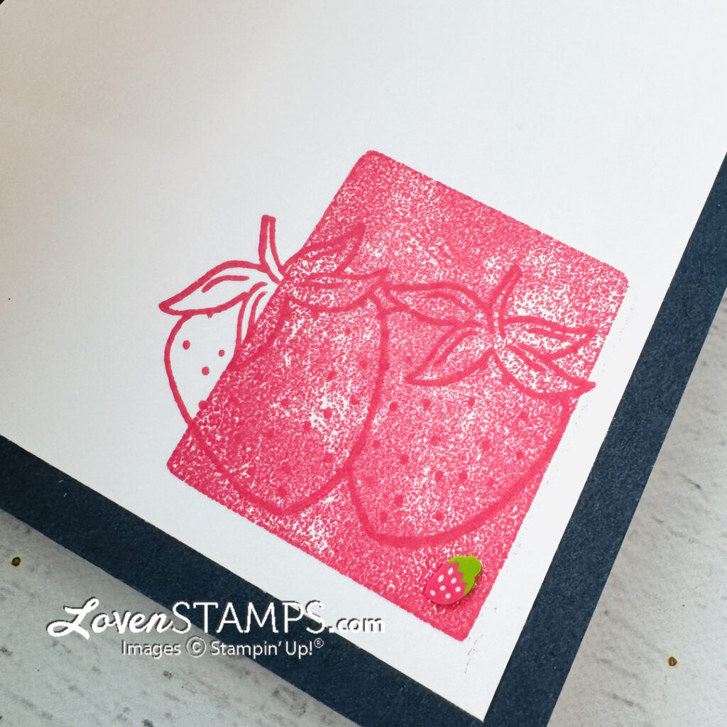overlapping strawberries stamped in pink slush ink on white cardstock layered on secret sea dark blue cardstock greeting card